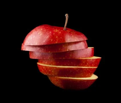 Cut red apple on a black background Stock Photos