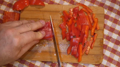 Cut Red Pepper on Board with Knife. Cooking Salad at Home. Homemade. Top view. 스톡 동영상 127785089