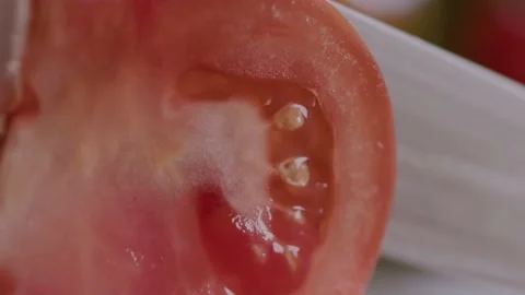 Cut red tomato. Macro. Raw, cutting board, knife, ingredient, cook, vegetable Stock Footage 151961592