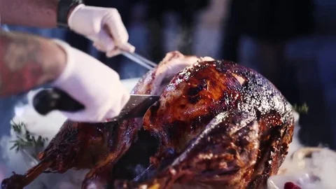 Cut Roasted meat for the Holiday Table Cook Video stock 73795280