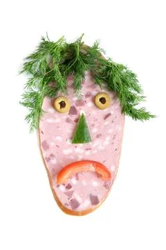 The cut sausage and vegetables in the shape of a sad face The cut sausage ... Stock Photos