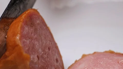 Cut sausage into slices close-up Video stock 104596603