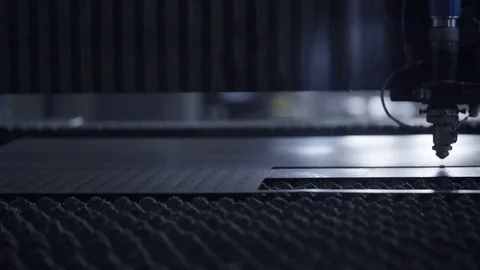 Cut sheet metal at workshop. Modern tool in heavy industry. Dangerous job. High Stock Footage 72544380