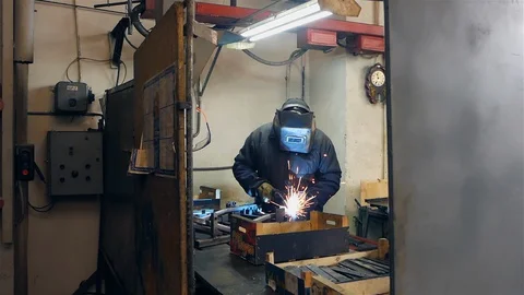 Cut sheet metal at workshop. Modern tool in heavy industry. Dangerous job. High Stock Footage 127734806
