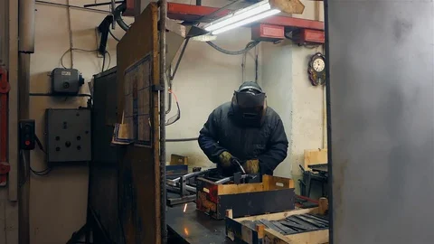 Cut sheet metal at workshop. Modern tool in heavy industry. Dangerous job. High Stock Footage 127735064