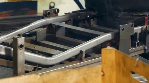 Cut sheet metal at workshop. Modern tool in heavy industry. Dangerous job. High Stock Footage 127736555