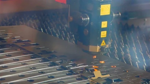 Cut sheet metal at workshop. Modern tool in heavy industry. Dangerous job. High Stock Footage 127737575