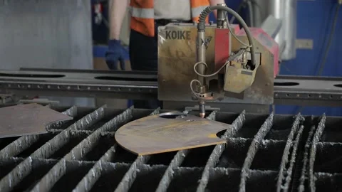 Cut sheet metal at workshop. Modern tool in heavy industry. Dangerous job. High Stock Footage 142892144