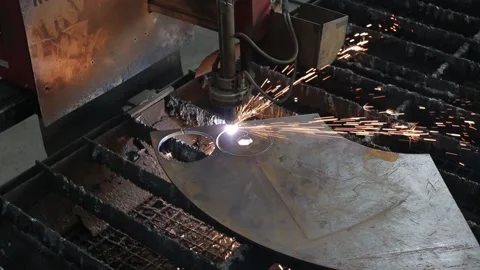 Cut sheet metal at workshop. Modern tool in heavy industry. Dangerous job. High Stock Footage 142892893