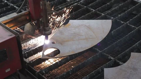 Cut sheet metal at workshop. Modern tool in heavy industry. Dangerous job. High Stock Footage 142900149