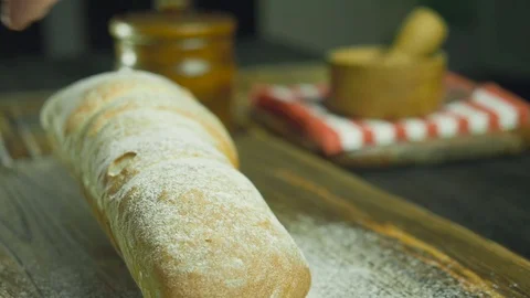 Cut slice of bread in slow motion, close up Stock Footage 72787644