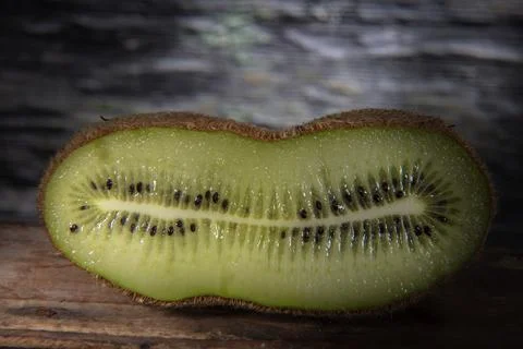 Cut off Slice of Doubled Kiwi Stock Photos