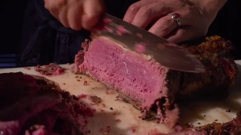 Cut a slice of juicy meat Stock Footage 73908386