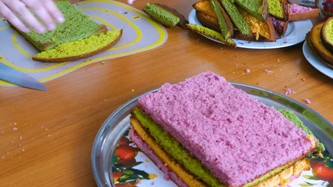 Cut slices of cakes into triangular pieces Stock Footage 123577513