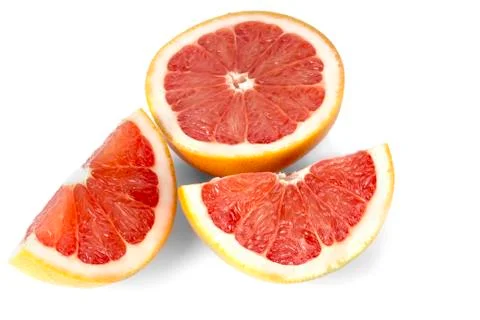 Cut slices of grapefruit Stock Photos