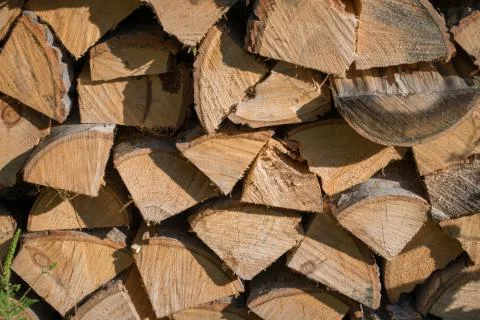 Cut split stacked firewood for winter background close-up Stock Photos