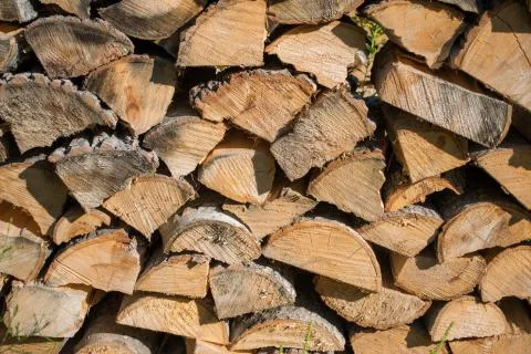 Cut split stacked firewood for winter background close-up Stock Photos