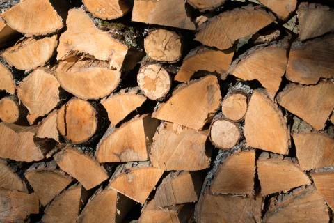Cut split stacked firewood for winter background close-up Stock Photos