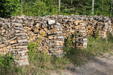 Cut split stacked firewood for winter background close-up Stock Photos