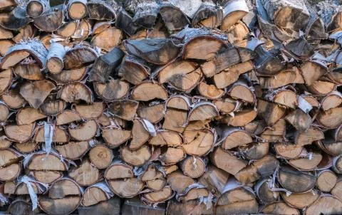 Cut split stacked firewood for winter background close-up Stock Photos
