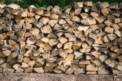 Cut split stacked firewood for winter background close-up Stock Photos