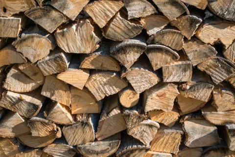 Cut split stacked firewood for winter background close-up Stock Photos