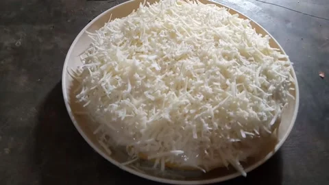 Cut the sponge cake sprinkled with grated cheese Stock Footage 232556446