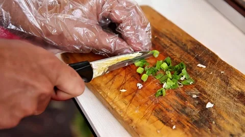 Cut the spring onions using a knife Stock Footage 300620991