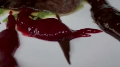 Cut steaks on plates Stock Footage 79507741