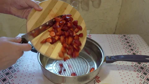 Cut strawberries into pieces Stock Footage 199755653