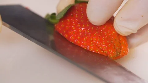 Cut strawberries, put on a dessert Stock Footage 116683847