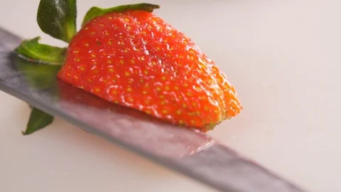 Cut strawberries, put on a dessert Stock Footage 116686077
