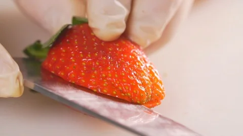 Cut strawberries, put on a dessert Stock Footage 116686205