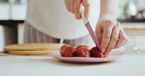 Cut Strawberry On White Surface By Knife Stock Footage 157066328