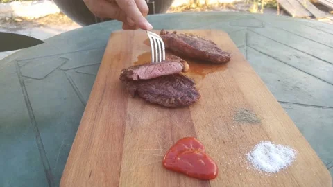 Cut the Striploin steak. Roasting medium/medium well Stock Footage 140185518