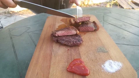 Cut the Striploin steak. Roasting medium/medium well Stock Footage 140185605