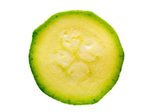 Cut a thin slice of zucchini, isolated on white background cut a thin slic... Stock Photos