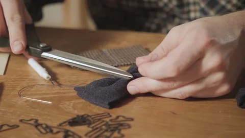 Cut the thread. Close-up creates the shape of a butterfly tie made of wool. Good Stock Footage 82845129
