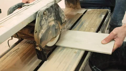 Cut the tile with a tile cutter. selective focus. Stock Footage 148161205
