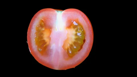Cut Tomato Isolated on Black Background Stock Footage 91094495