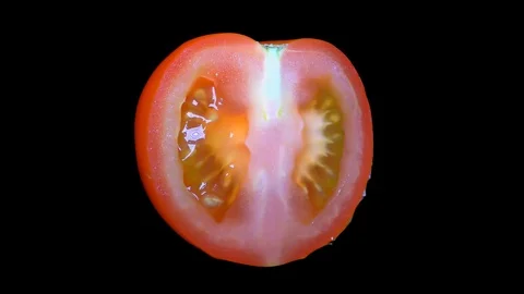 Cut Tomato Isolated on Black Background Stock Footage 91094565