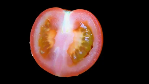 Cut Tomato Isolated on Black Background Stock Footage 91094574