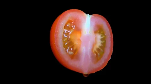 Cut Tomato Isolated on Black Background Stock Footage 91094645