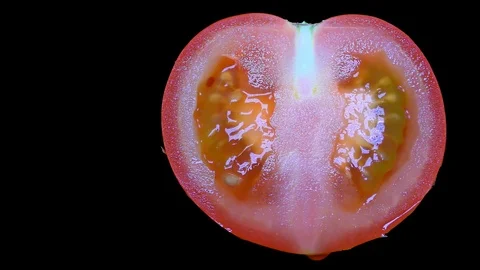 Cut Tomato Isolated on Black Background Stock Footage 91094733