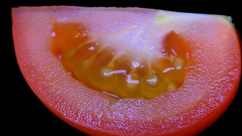 Cut Tomato Isolated on Black Background Stock Footage 91094763
