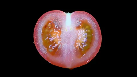 Cut Tomato Isolated on Black Background Stock Footage 91094827