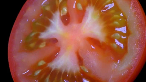 Cut Tomato Isolated on Black Background Stock Footage 91094931
