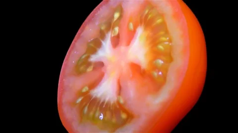 Cut Tomato Isolated on Black Background Stock Footage 91094963
