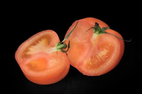 The cut tomato Photos