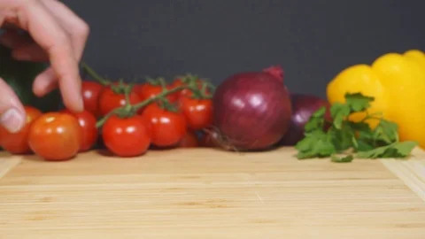 Cut the tomato for the salad. Stock Footage 124076609